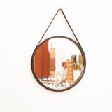 Round mirror in walnut