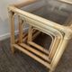 Trio of vintage pull-out tables in rattan and smoked glass 70s