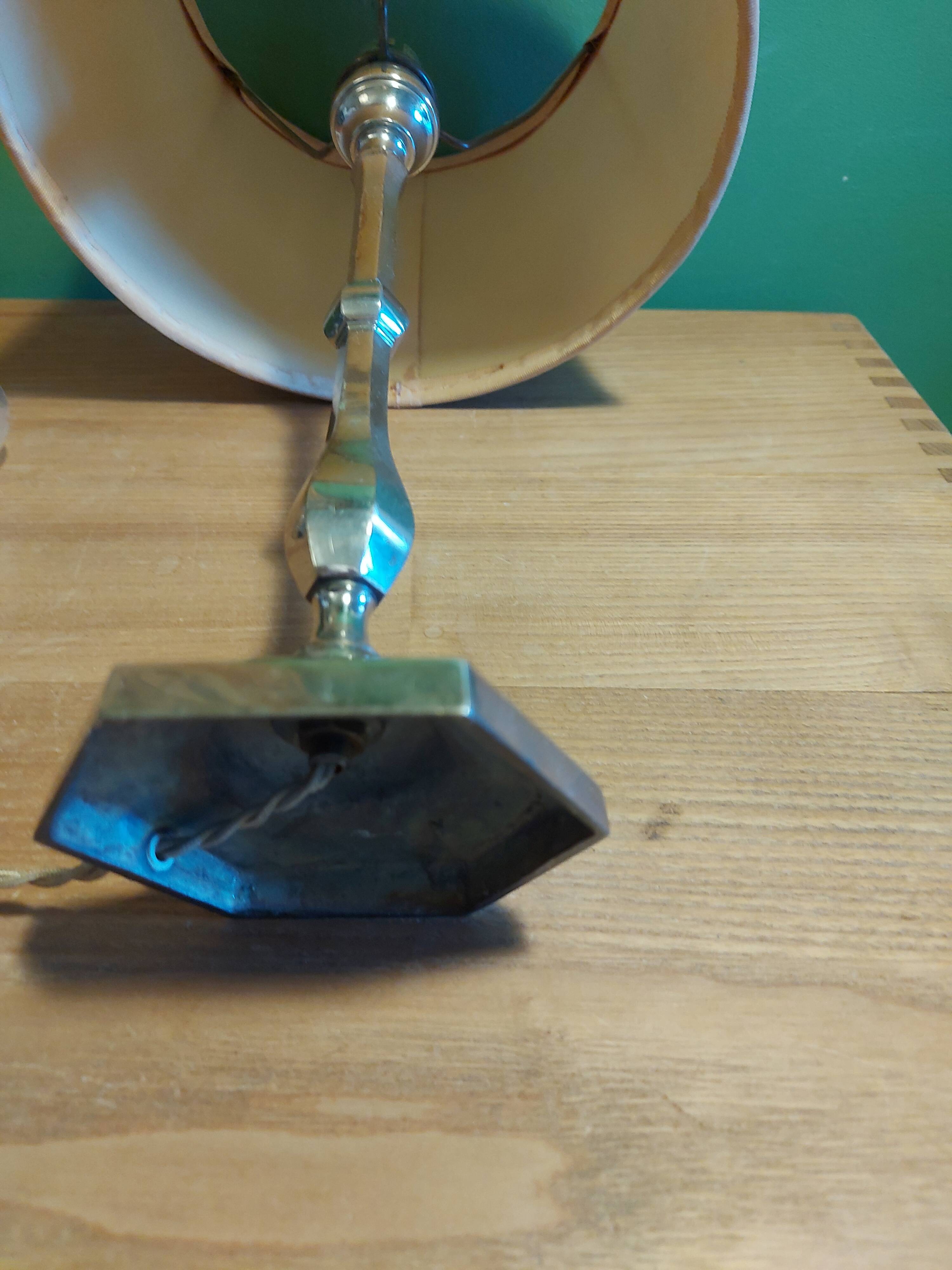 Silver metal lamp with its lampshade