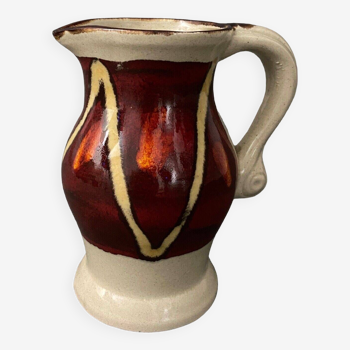 Ceramic pitcher 1930 white and red background