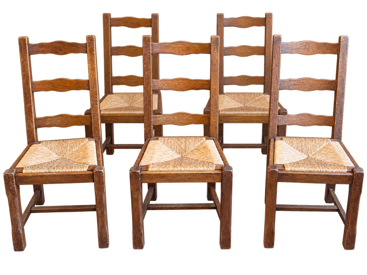Set of 6 wooden chairs with straw seats and high backs.