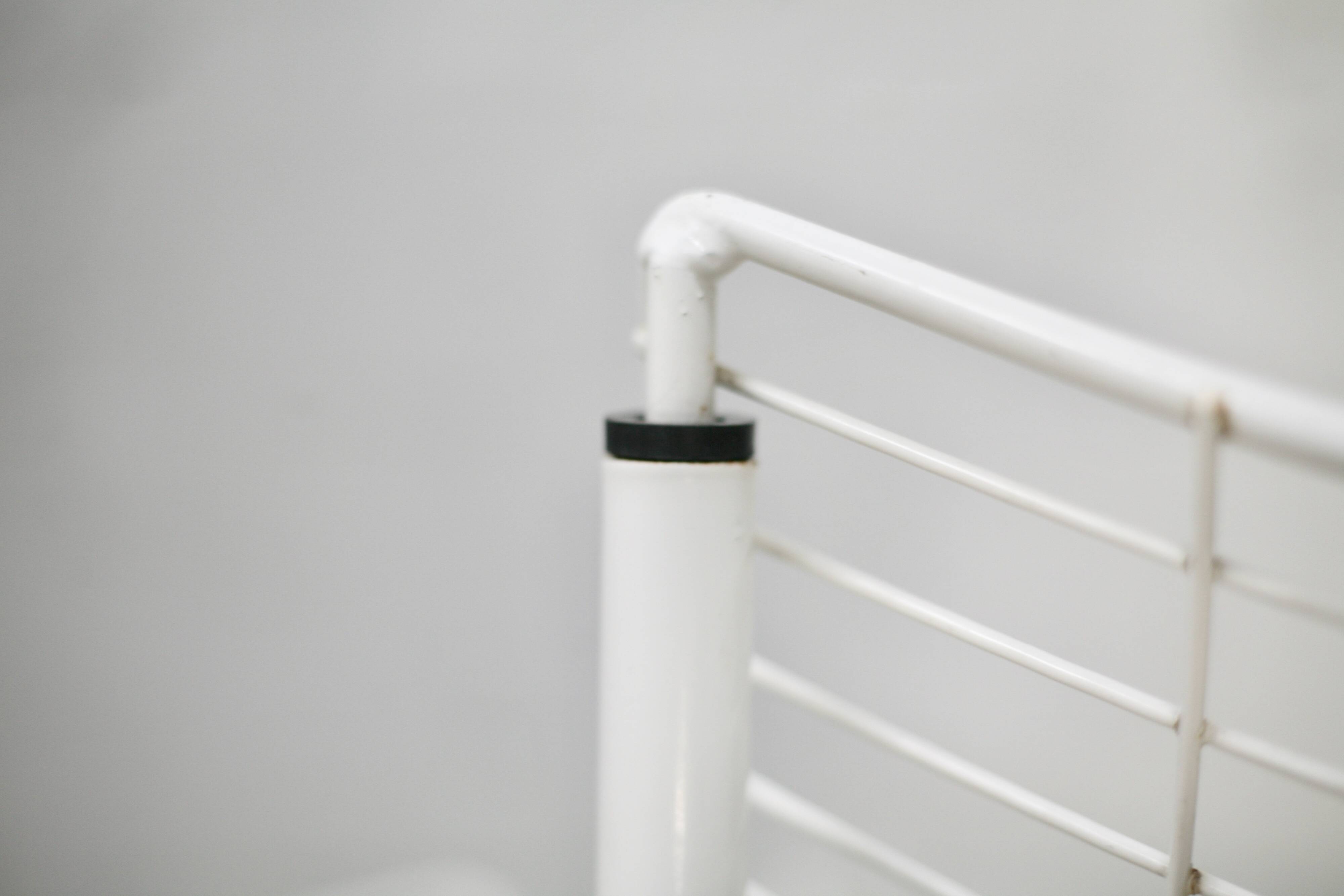 Pair of white lacquered steel rod armchairs. Circa 1985