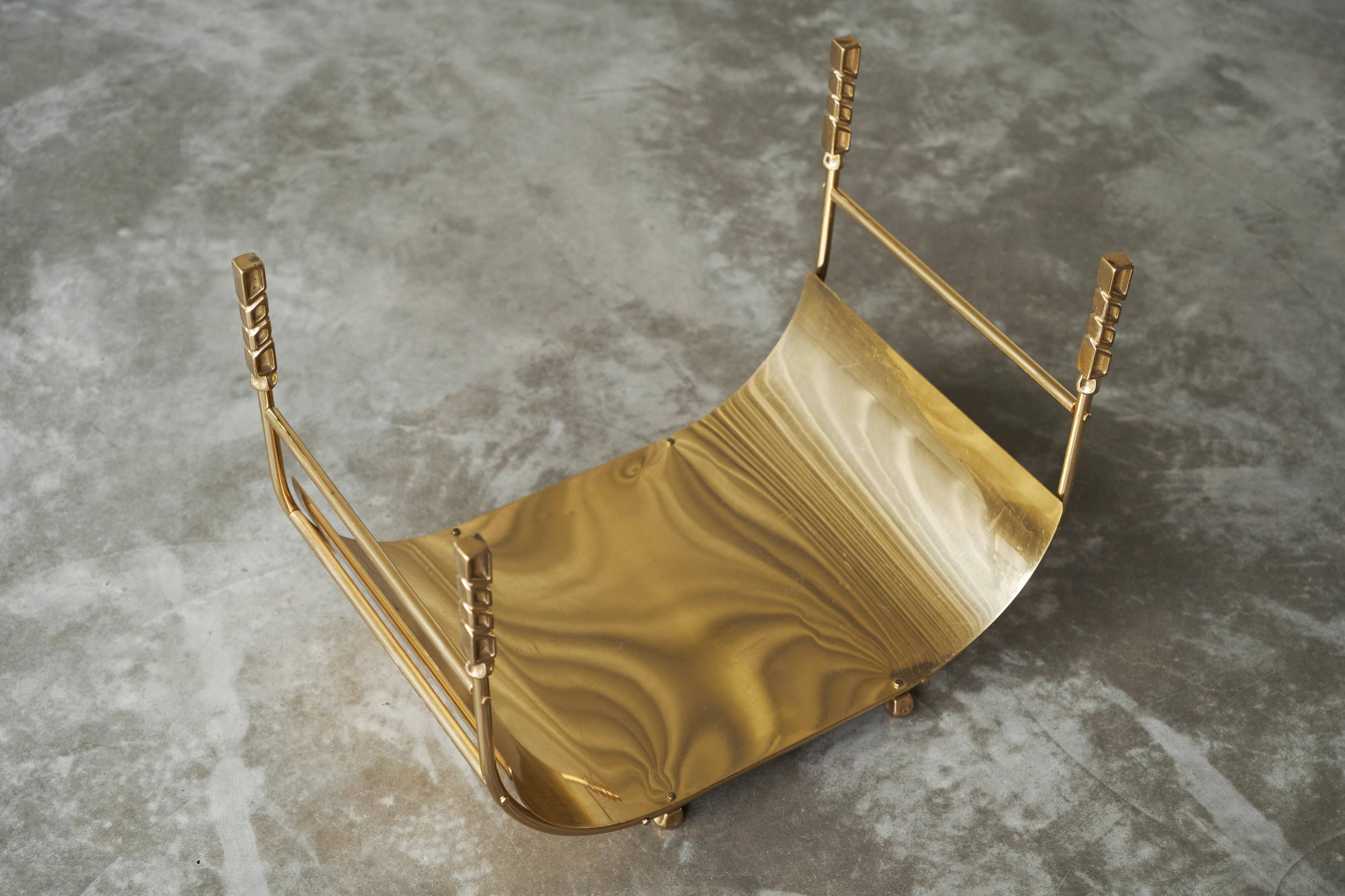 Sculptural brass magazine rack or basket from the 1970s.