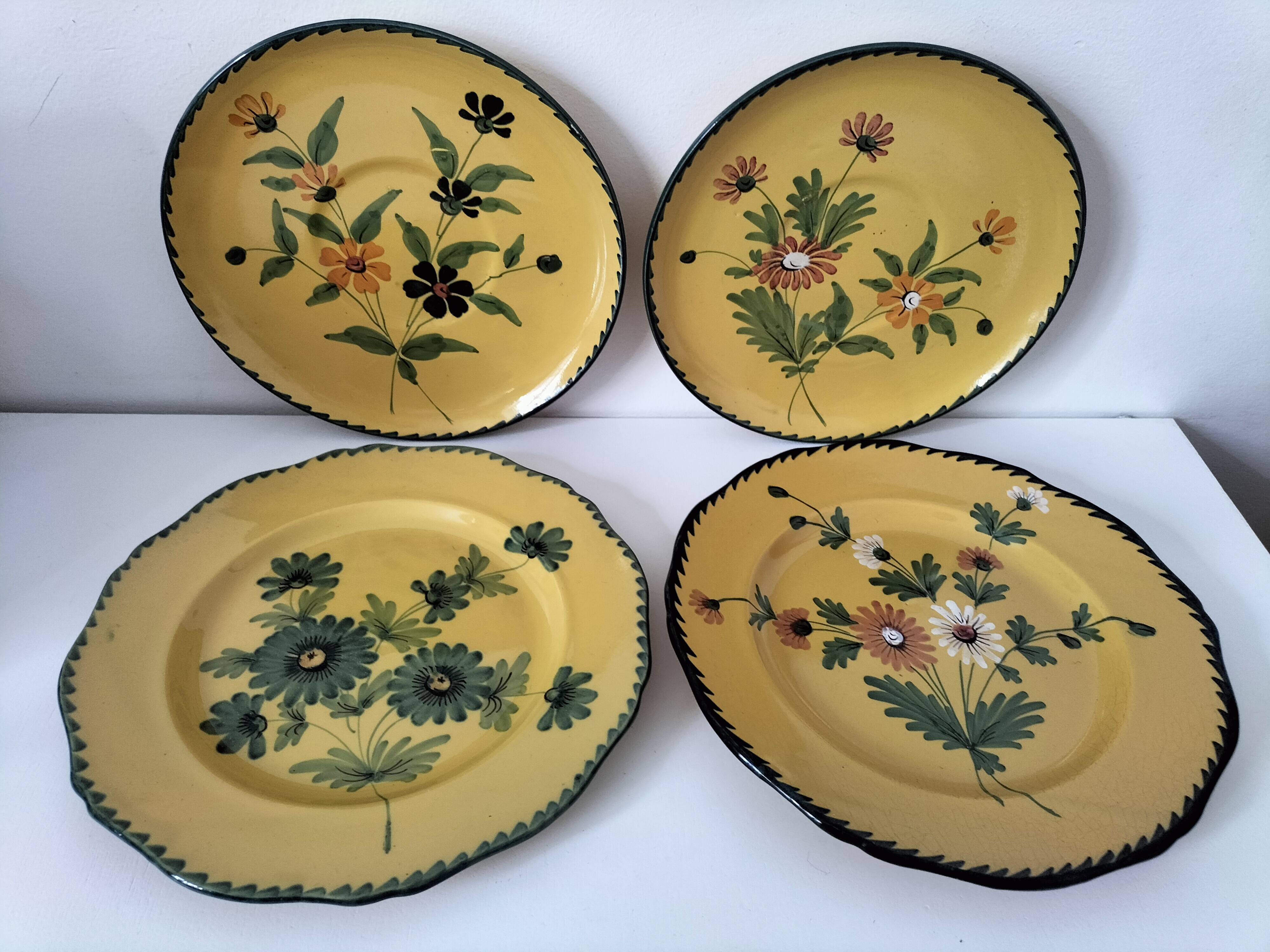 4 antique plates in hand-painted faience