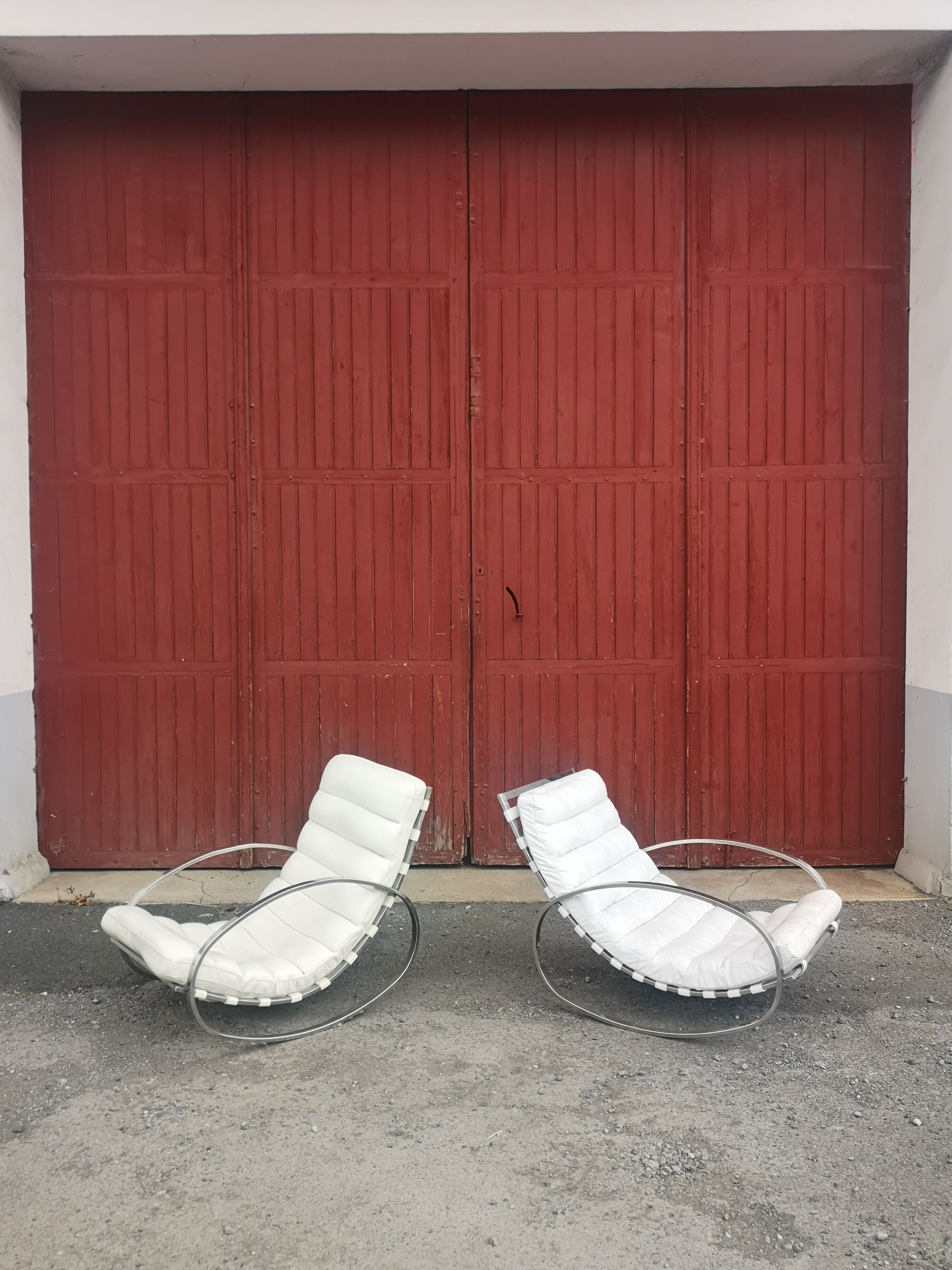 Pair of vintage chrome and leather rocking chairs