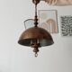 Rustic old wooden and brass suspension.
