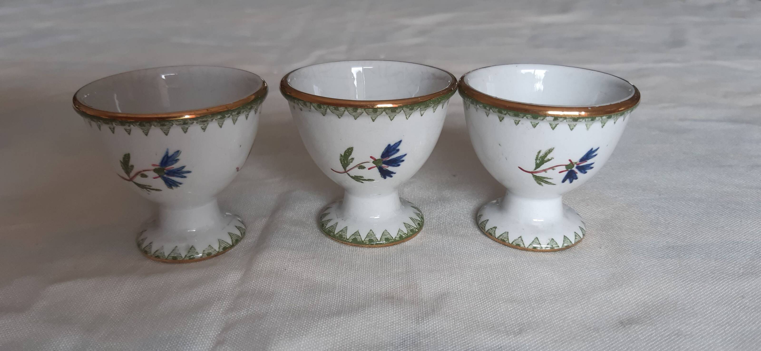 Set of three egg cups, barbel pattern decorations
