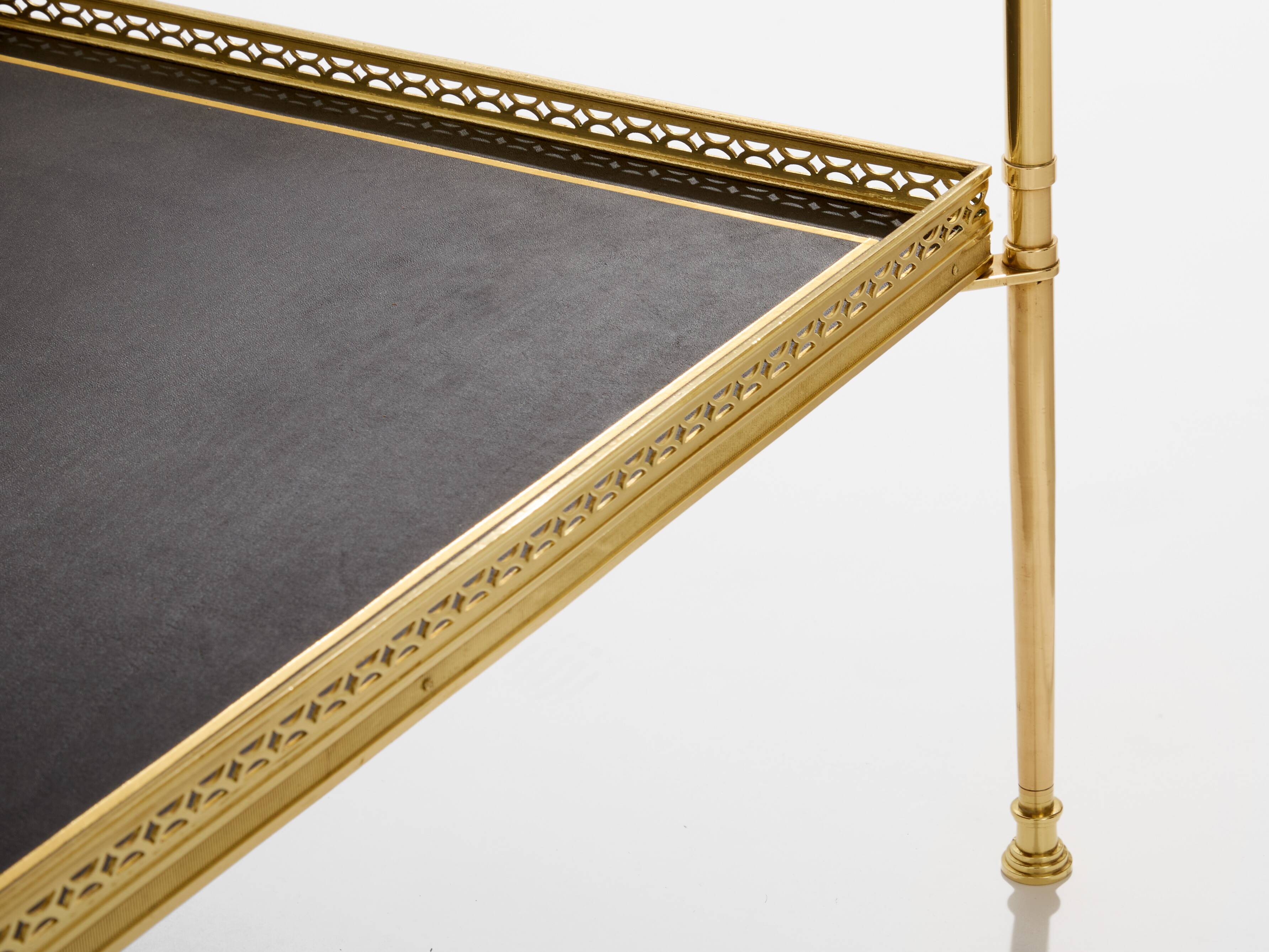 Pair of neoclassical side tables in brass and black leather by Maison Jansen, 1960.