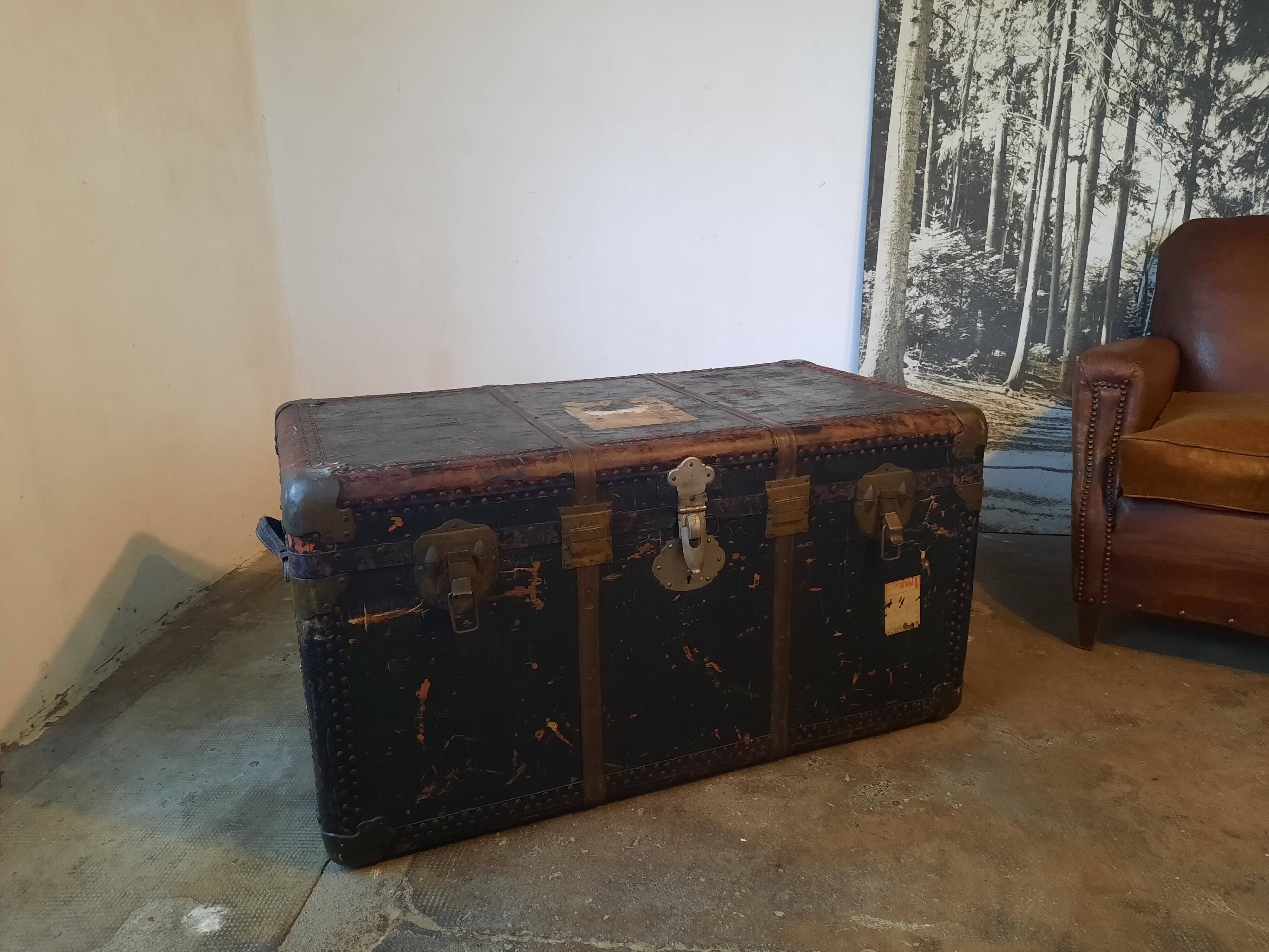 Old and large travel trunk, brass-plated corners
