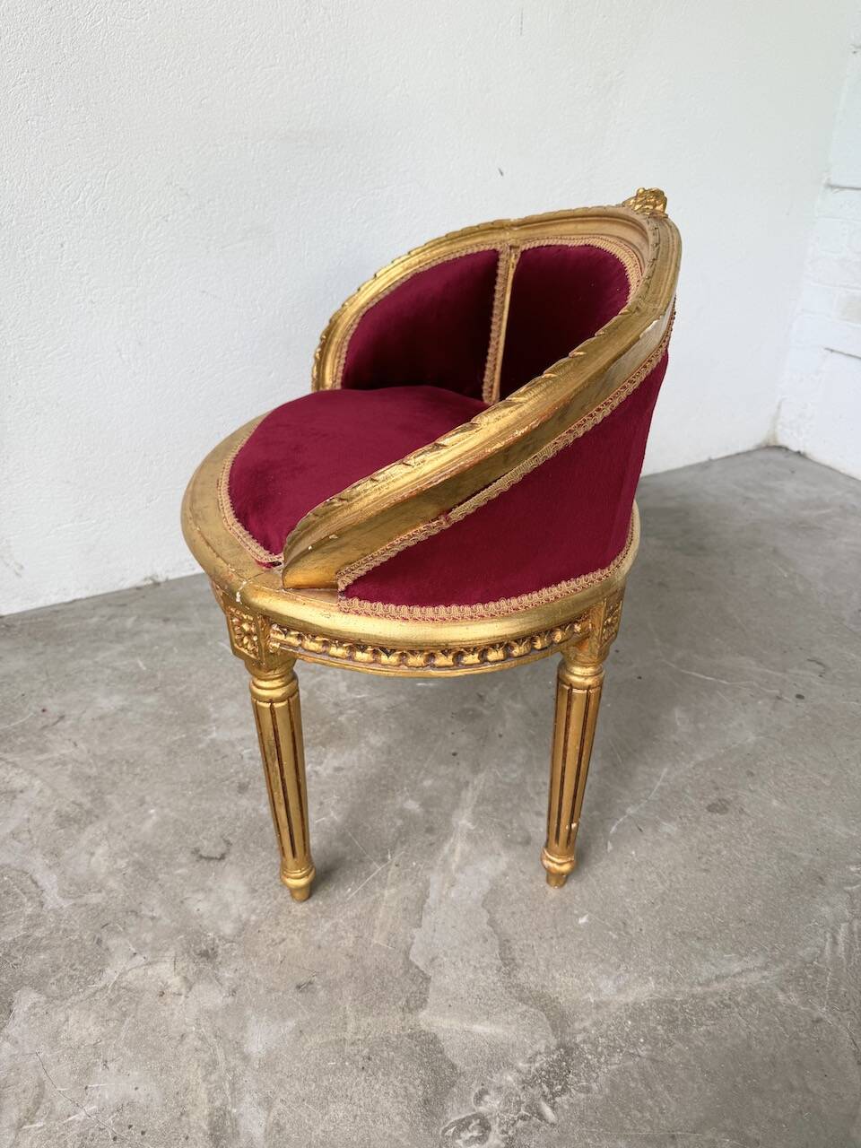 Louis XVI gilt wood and red velvet armchair