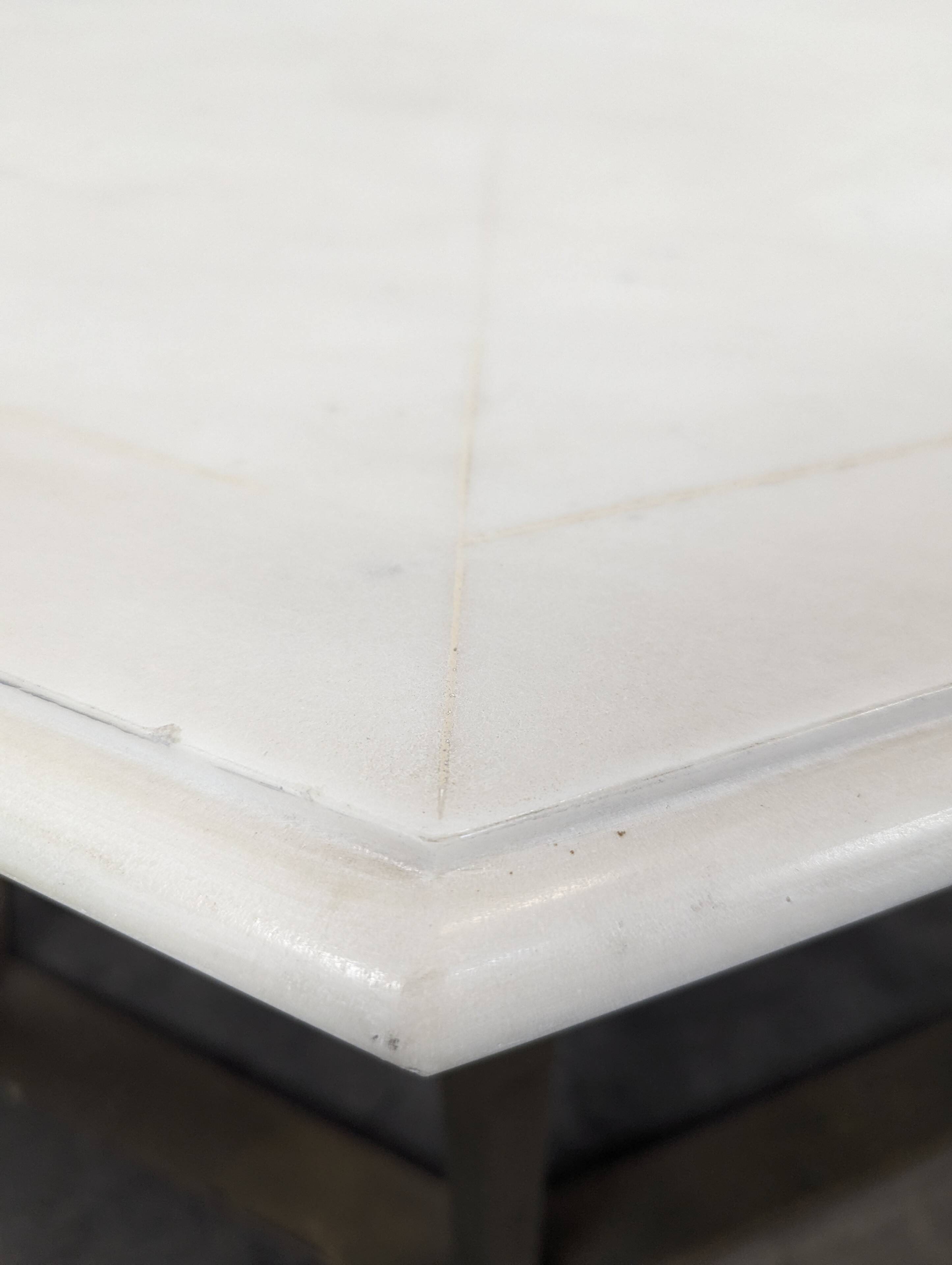 1940s octagonal coffee table with a marble top.