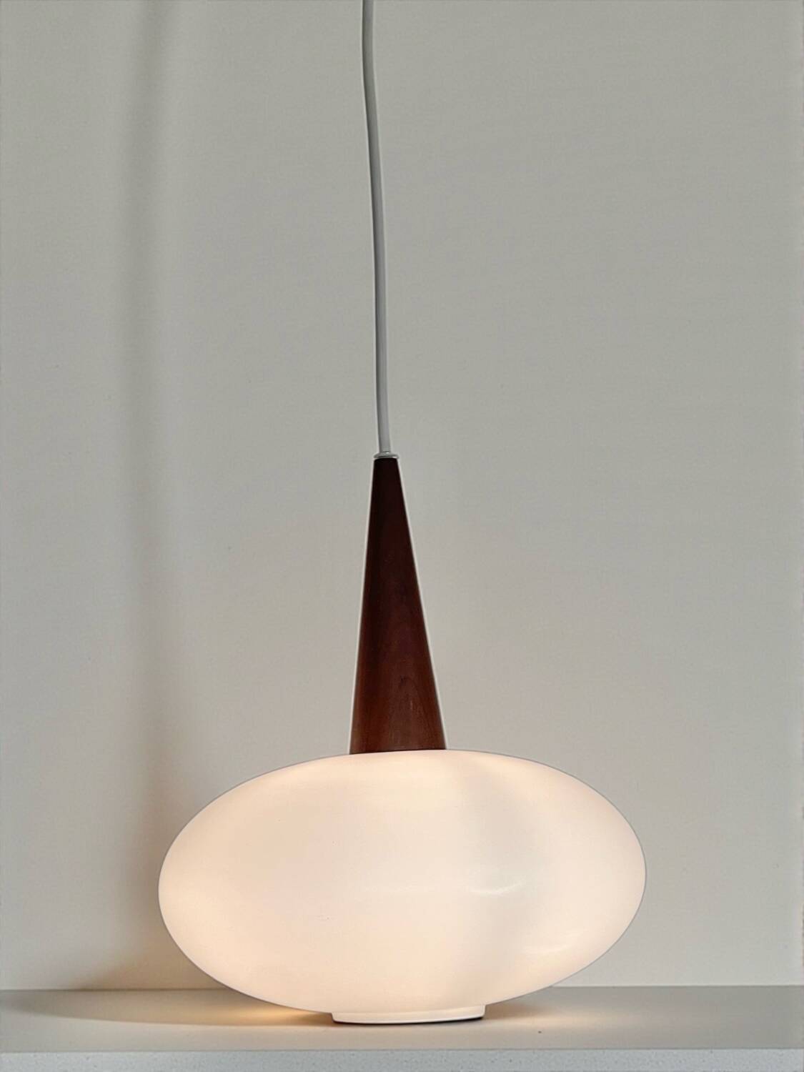 Vintage suspension light in opaline by Louis Kalff for Philips from 1968.