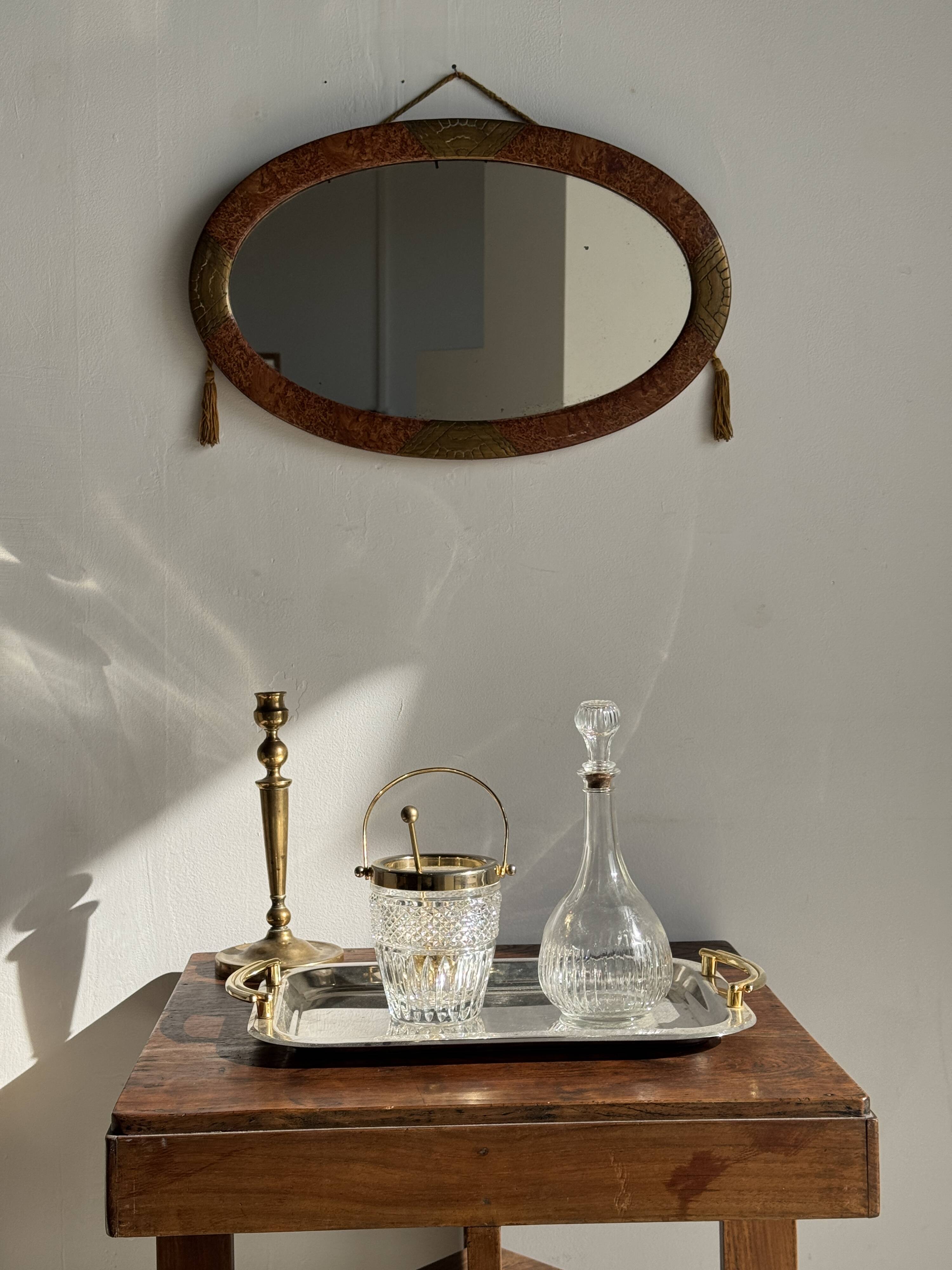 Small oval Art Deco mirror in brown and gold 33x54.