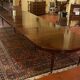 Extensible dining table from the Louis XVI period in mahogany with a banded top.