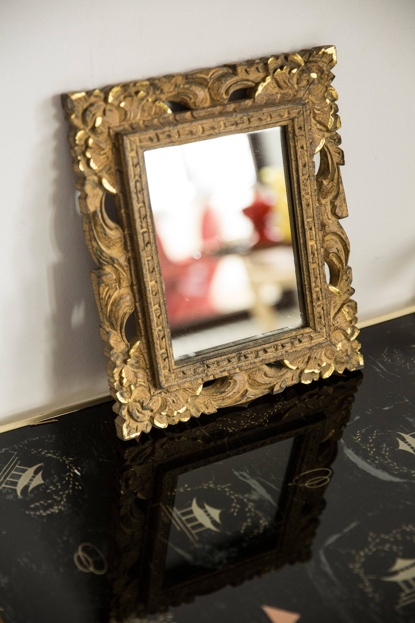 Decorative gold mirror mid-century in a wooden frame, Italy, 1960s.