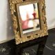 Decorative gold mirror mid-century in a wooden frame, Italy, 1960s.
