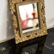 Decorative gold mirror mid-century in a wooden frame, Italy, 1960s.