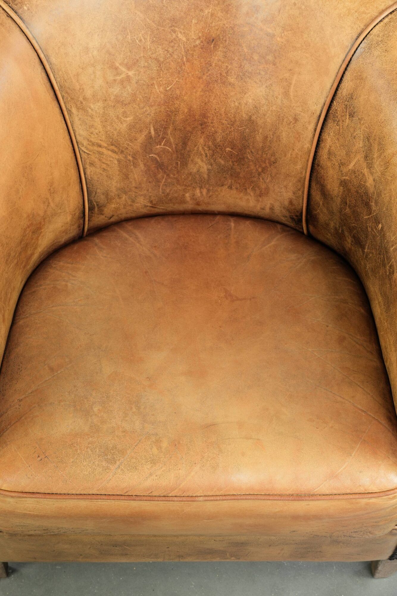 Vintage sheepskin club armchair in a light cognac colour