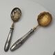 Pair of silver Minerva and vermeil shakers, 19th century.