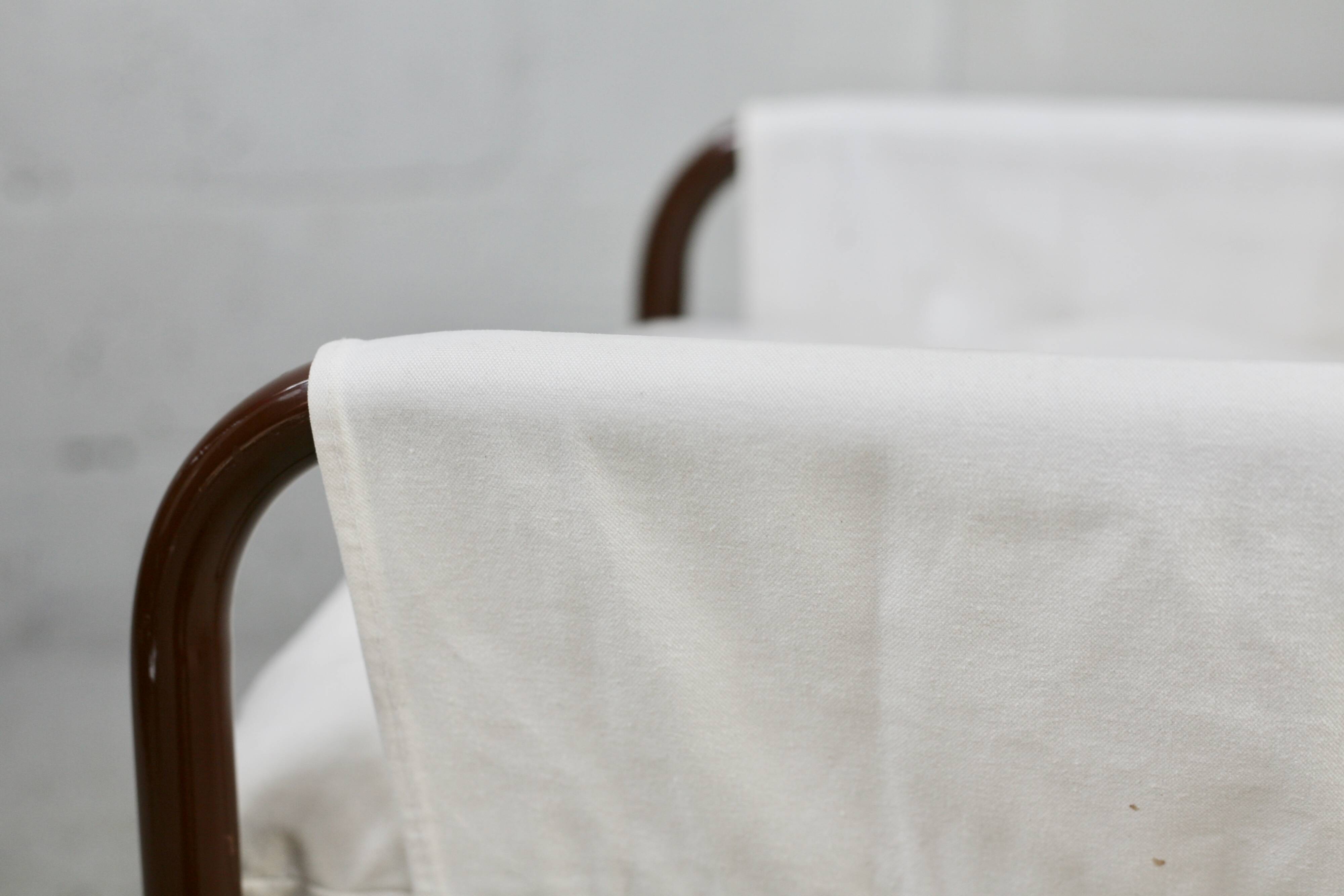 Tubular armchair, fabric suspended seat. Circa 1970