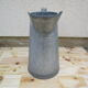 Old zinc garden broc