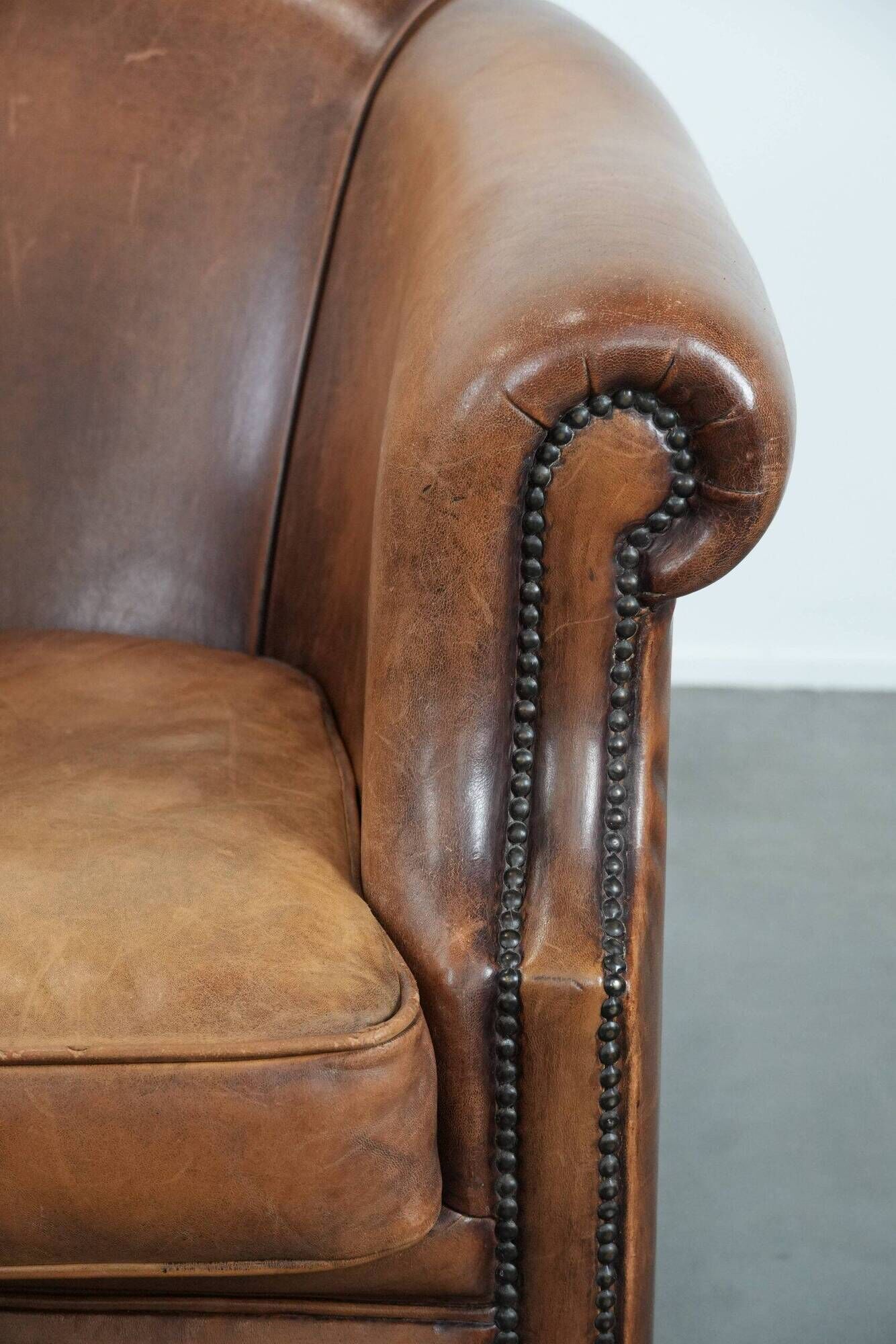 Comfortable club chair made of sheepskin leather