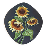 Decorative wall plate with sunflowers.