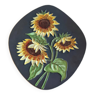 Decorative wall plate with sunflowers.