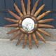 Miroir soleil en bois et stuc doré, années 50