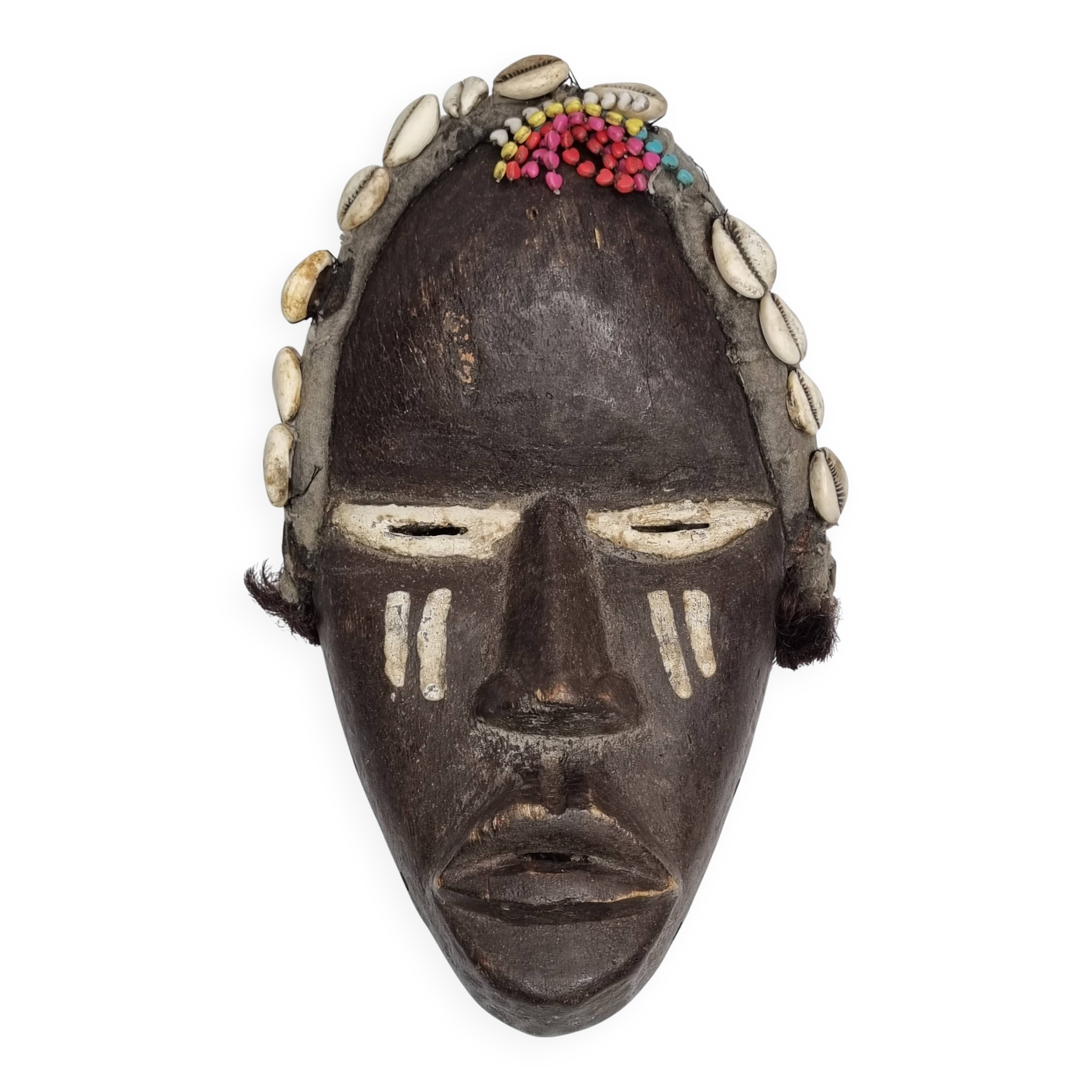Tribal Dan mask in wood and cowrie shells, West Africa, 27 cm