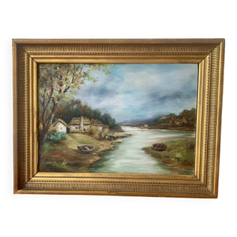 Large painting of a house by the water