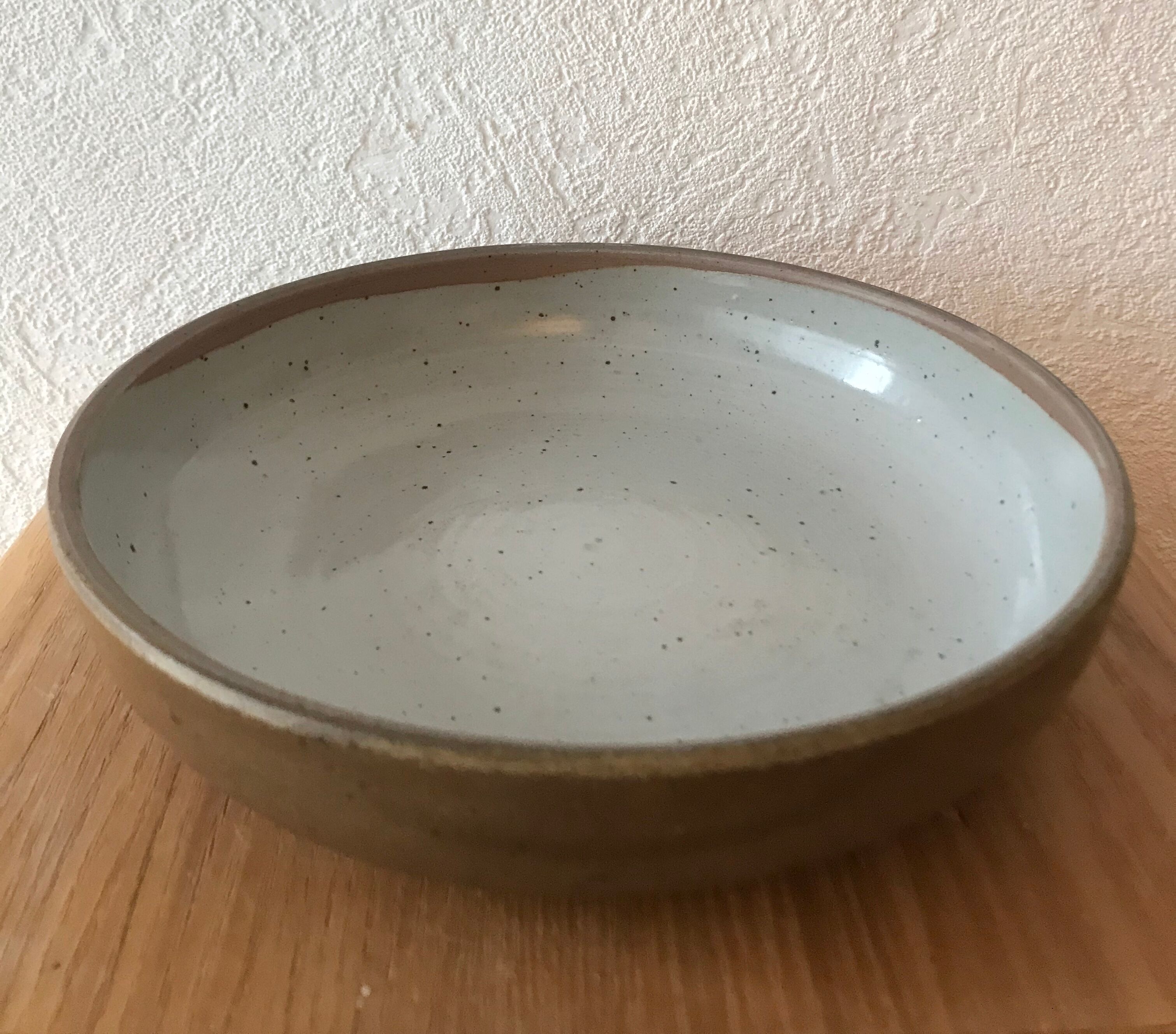 Hollow dish in enamelled sandstone
