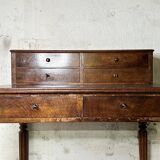 Wooden lady's desk says "happiness of the day"