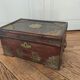 Old Indian wooden wedding chest decorated with chiseled brass plaque. India late 19th/early 20th