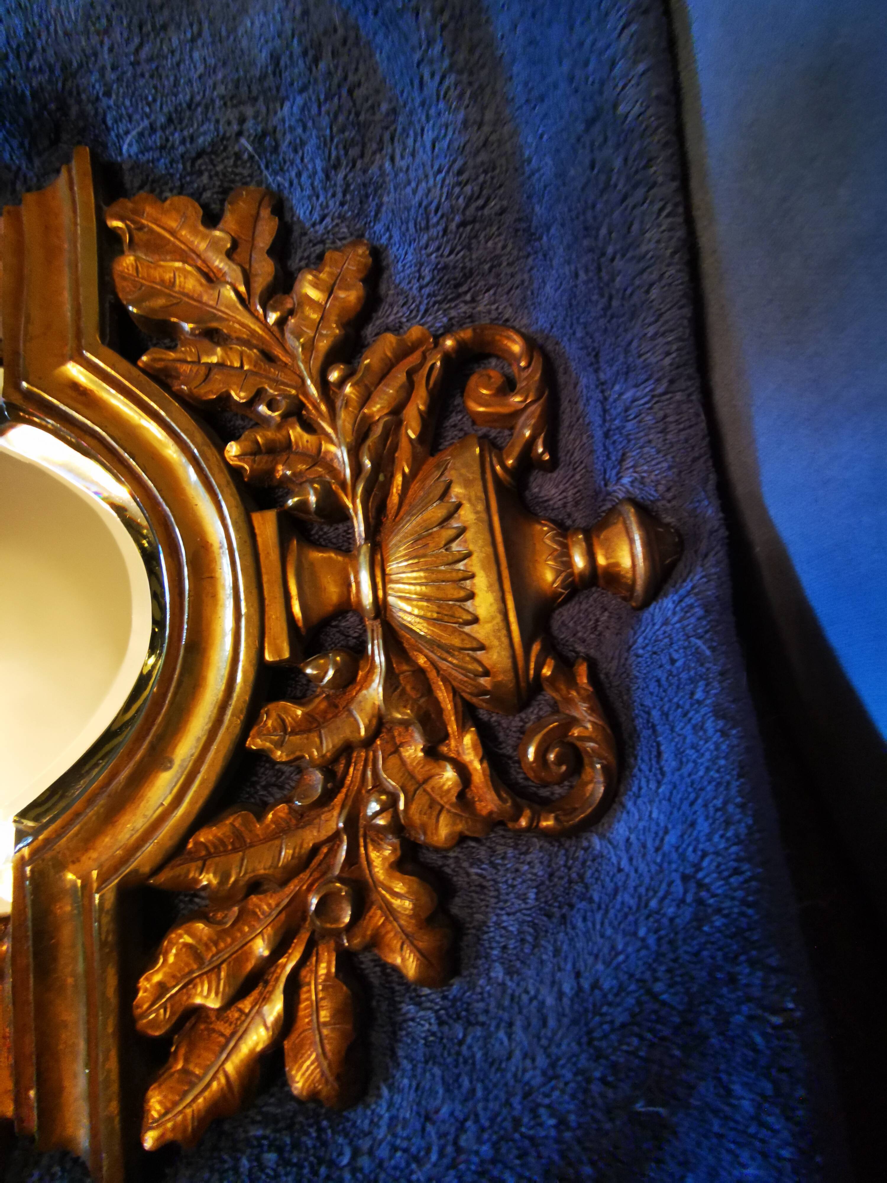 Pair of chissed and gilded bronze mirrors forming appliques