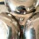Servant in silver metal pine cone