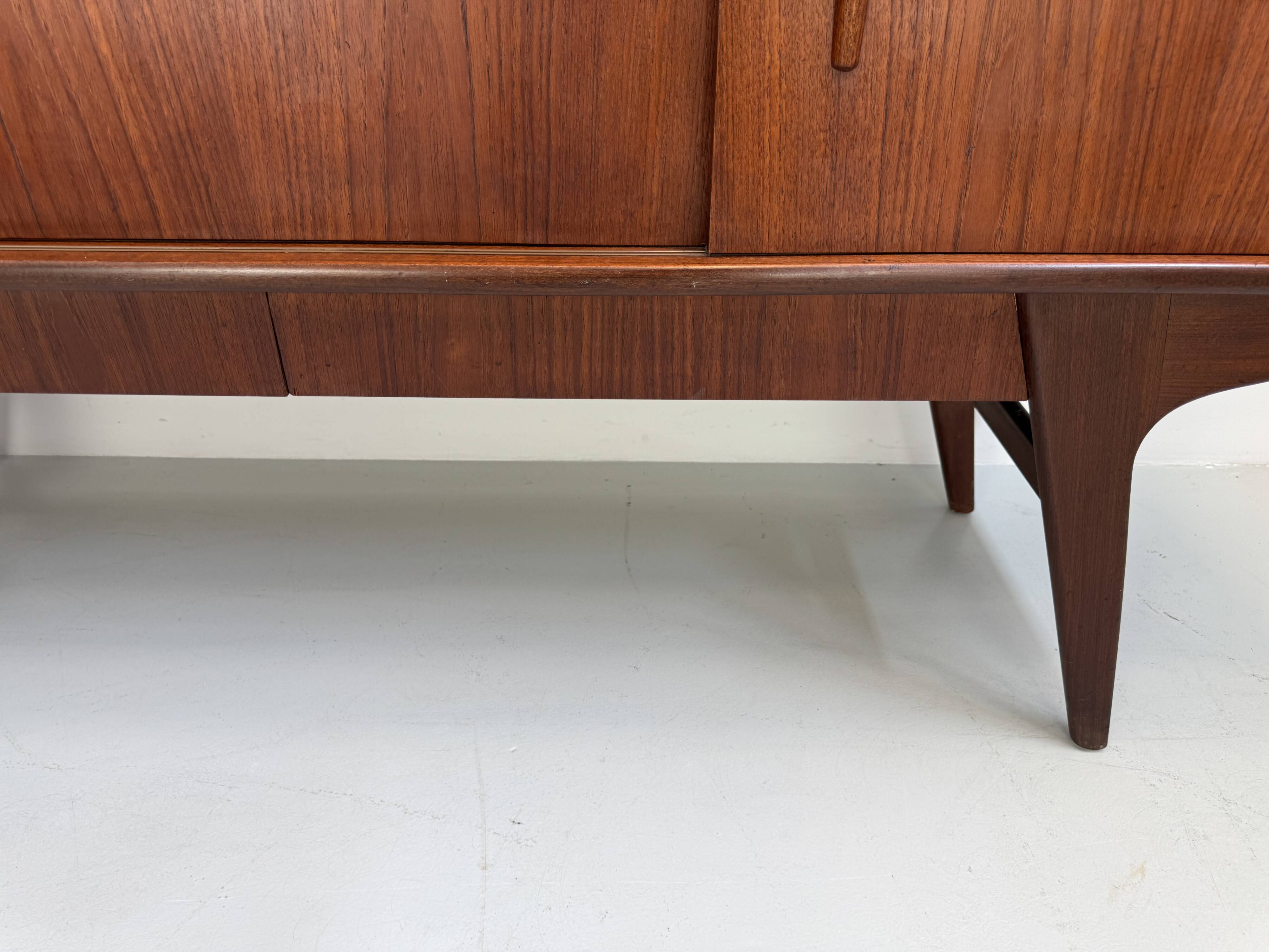 Vintage Danish teak wall unit with sliding doors from the 1960s.