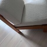 Vintage wooden armchair with curly seat