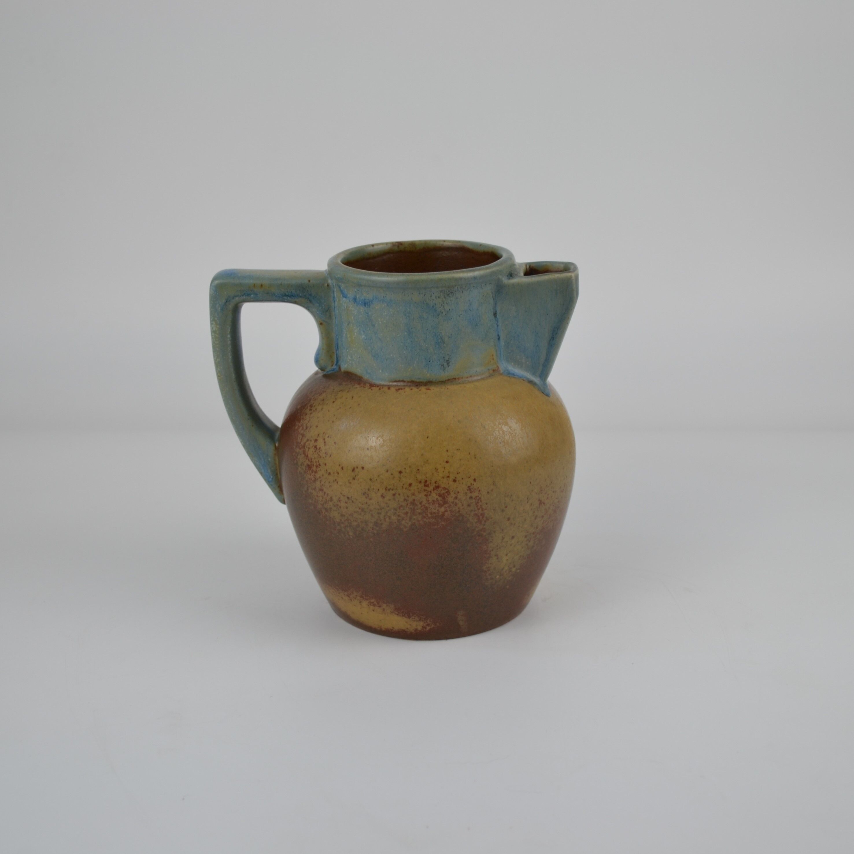 Two-tone stoneware pitcher by Louis Lourioux