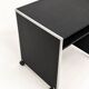 Vintage black computer desk on wheels with an aluminium edge.