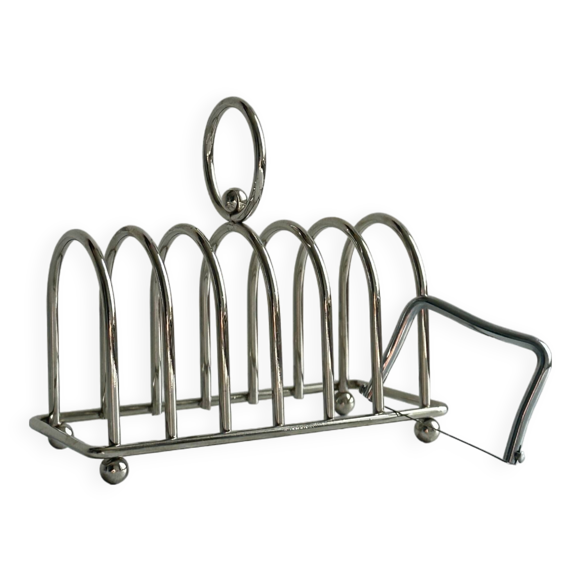 Porte-toast en métal argenté.