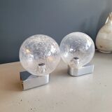 Pair of vintage wall lights in chrome metal with bubbled glass globes.