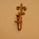 A pair of antique brass wall sconces.