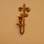 A pair of antique brass wall sconces.