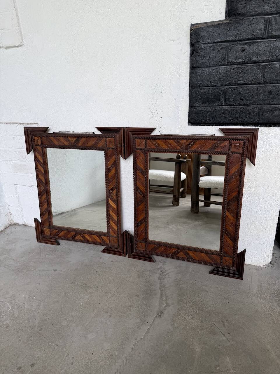 Pair of wooden mirrors in tramp art style