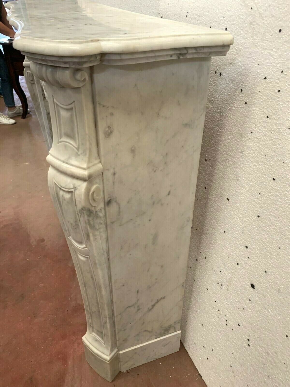 Louis XV style fireplace in white marble veined Carrara Italy 20th century