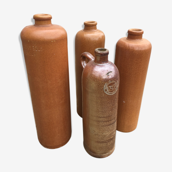 Lot of 4 sandstone bottles