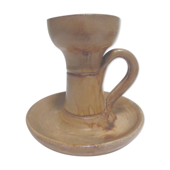 Candlestick in sandstone, cellar rat