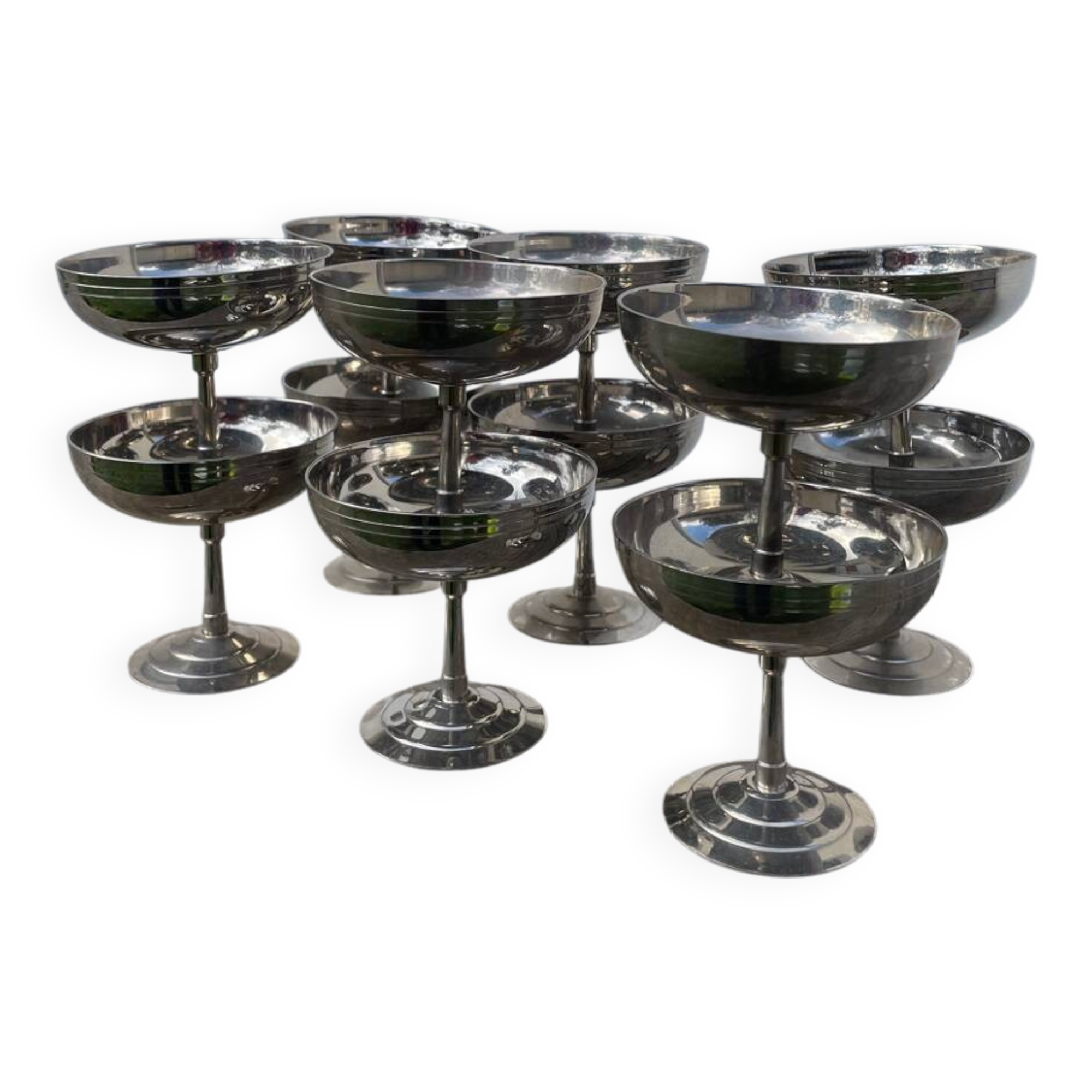 10 stainless steel cups signed Rémy Letang