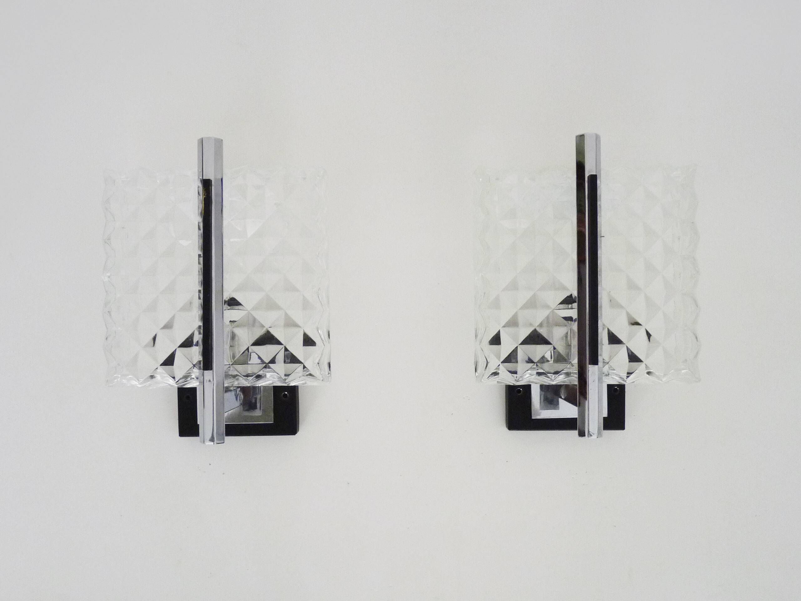 Pair of modernist glass and chrome metal wall sconces. 1960s-70s